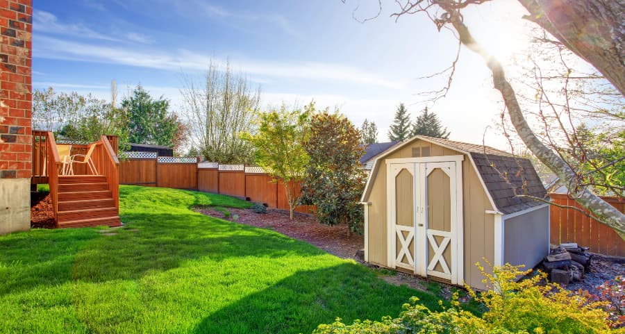 Fenced backyard with storage shed in Tuscaloosa